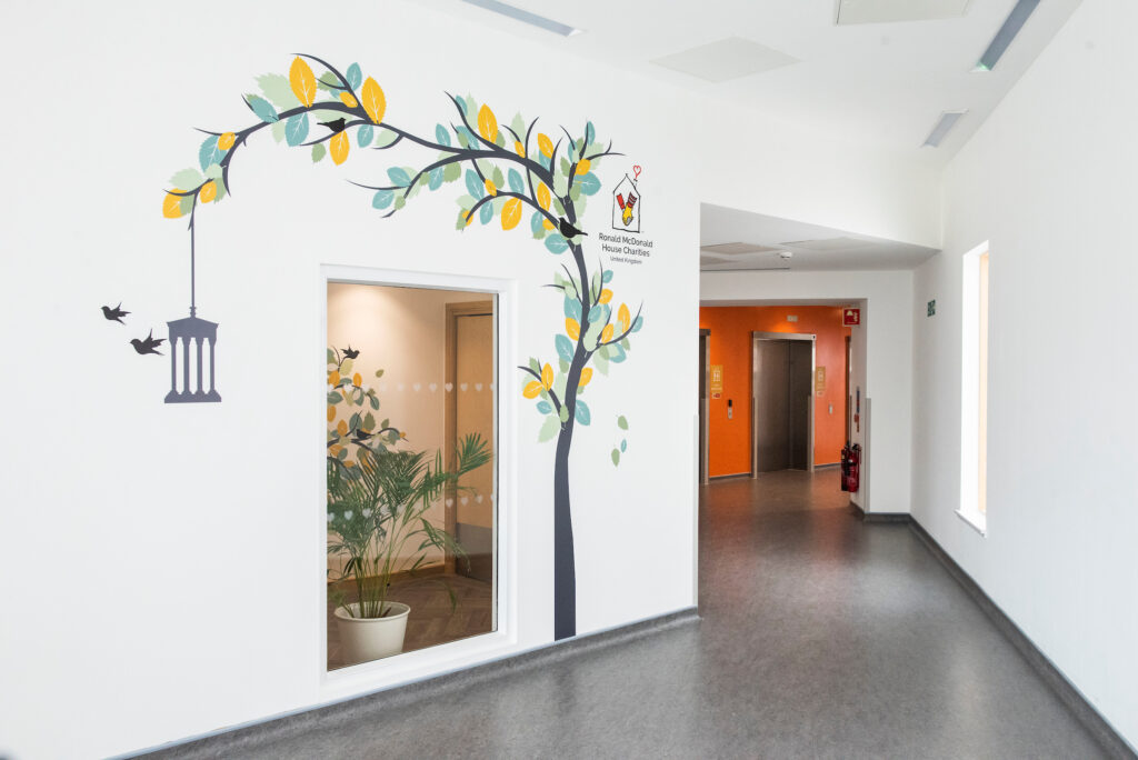 hallway in trauma department with mural of tree on the wall
