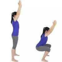 a woman standing with her hands straight up in the air and then in squat position while hands still iin the air