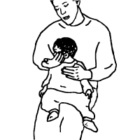 a man holding a baby on their lap facing away from them. Holding their left shoulder steady so that their body will not twist when they move their head.