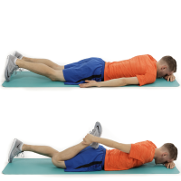 man lying on tummy and then on his tummy with one knee bent holding his foot with his hand and pulling his heel down towards his bottom.