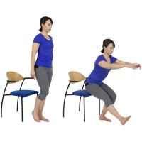 The diagram shows two positions Position 1: A woman is standing on one leg (the affected leg) in front of a sturdy chair, with the other leg slightly raised off the ground. Position 2: The woman is slowly lowering herself toward the chair, with her hips bent and the back of her legs just about to touch the chair, maintaining balance on the affected leg. Her arms are outstretched for balance.